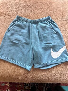 3 pairs of Nike Men’s Blue, Green, and Black Swoosh Active Shorts